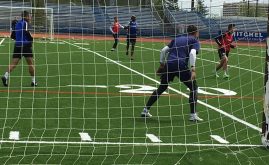 soccer players on temporary synthetic grass turf