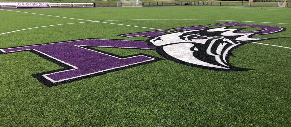 Niagara University logo on artificial grass turf