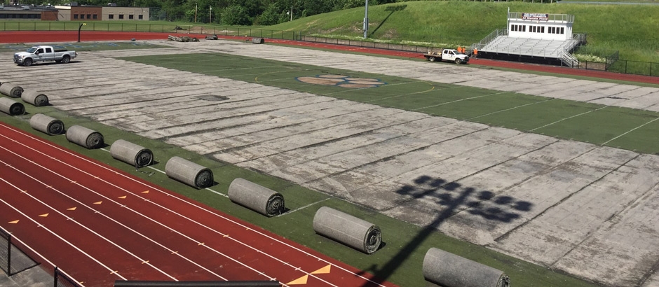 Crew removing old turf at Solvay