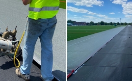 crew installing shock pad beneath artificial grass system