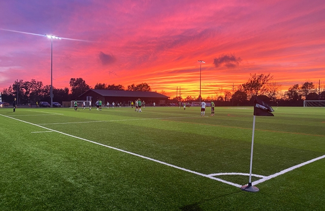 soccer players on artificial grass field turf